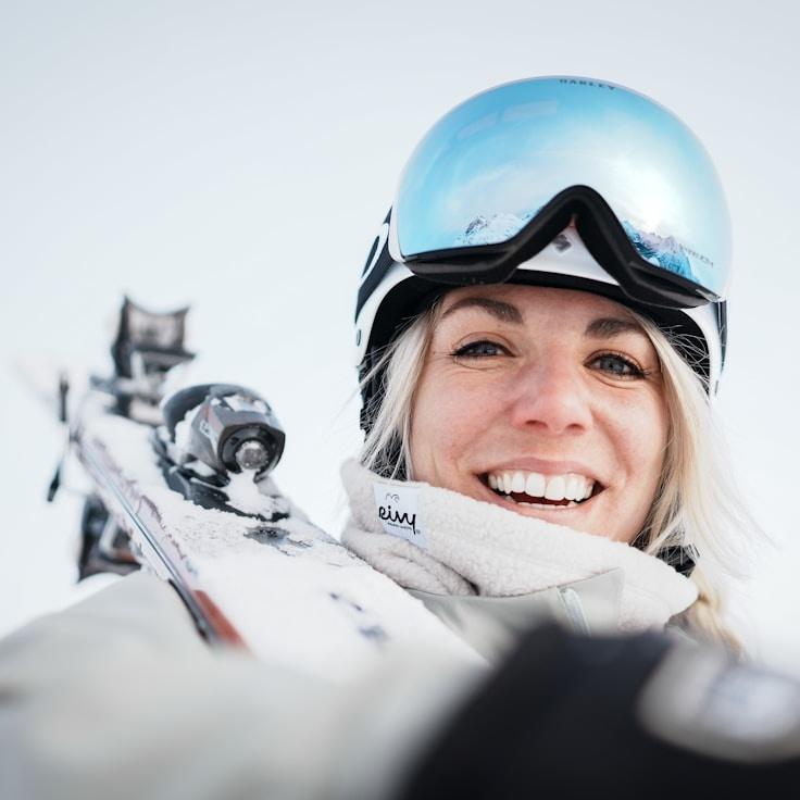 Alex Kim, Lead Design Curator at ShimmerMeadowOak, reviewing corporate floral arrangements